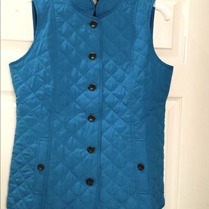 Peacock blue vest.